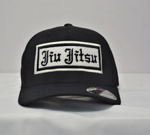 Load image into Gallery viewer, Old English Gi Material Logo - 5 Panel Flexfit Hat
