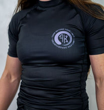 Load image into Gallery viewer, LIMITLESS S/S FEMALE RASH GUARD - BLACK/PURPLE (LIMITED STOCK)
